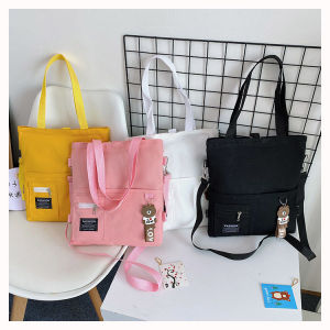 กระเป๋าผ้าใบอเนกประสงค์ชายและหญิงนักเรียนระดับประถมศึกษาไหล่ใหม่นักเรียนมัธยมต้นกระเป๋านักเรียนเกาหลีรุ่นความจุขนาดใหญ่ messenger