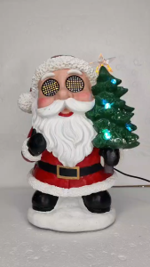 ONELINE #FC707 Animated musical Santa Claus figurine made of resin featuring glowing LED grid eyes and holding a decorated light-up Christmas tree