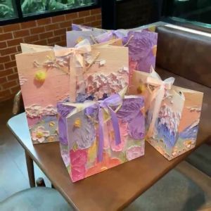 :: แพ็ค2ใบ :: **ไม่ใช่งานนูนค่ะ** ถุงกระดาษลาย 3 มิติ หวานๆ ริบบิ้น 2 เส้น ตามรูปเลย พร้อมส่ง