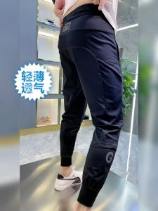 กางเกงลำลองชายผ้าตาข่ายระบายอากาศได้ดี กางเกงขายาวทรงหลวม สไตล์ลำลอง กางเกงขายาวลายตัวอักษรทันสมัย ทรงหลวม