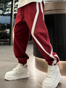 กางเกงวอร์มทรงหลวมสไตล์ลำลองสำหรับผู้ชาย ทรงสปอร์ต ลายทาง เอวยางยืด ผ้าฝ้ายผสมโพลีเอสเตอร์ กางเกงขายาว