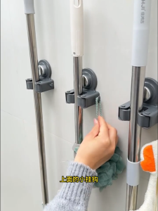 YissTiee Drill-free wall-mounted mop and broom holder/organizer for the bathroom