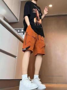 กางเกงขาสั้นทำงานสีส้มสำหรับผู้หญิง ฤดูร้อน 2025 กางเกงขายาวผ้าไหมน้ำแข็งแห้งเร็ว กางเกงขายาวทรงหลวม 5 นิ้ว กางเกงขายาวทรงหลวม