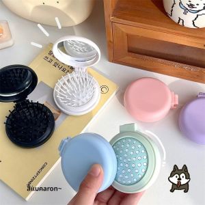 2/6 ชิ้น Macaron ถุงลมนิรภัยหวีสีทึบแบบพกพากระจกหวีนวดสําหรับสาว Candy สีผมหวีพับ