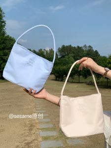 กระเป๋าถือทรงถังผ้าไนลอน ซิปรูดแบบแม่เหล็ก กระเป๋าสะพายไหล่ข้างเดียวสำหรับฤดูร้อน เวอร์ชั่นไฮเอนด์สำหรับผู้หญิง กระเป๋าถือแบบลำลอง