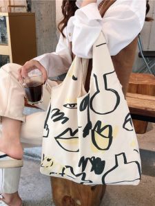 กระเป๋าผ้าใบลายการ์ตูนความจุขนาดใหญ่สำหรับใส่ของใช้ประจำวัน กระเป๋าสะพายไหล่แบบลำลองสำหรับนักเรียนหญิง