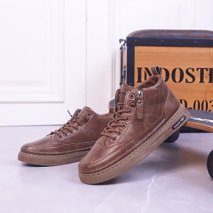 Brown high-top sneakers with laces and side zippers. Thick soles. "Since 1921" label Leather ankle boots