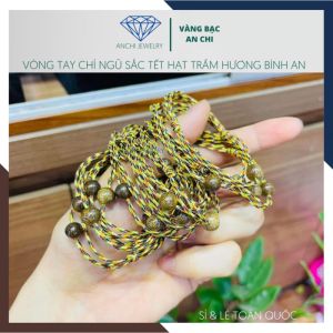 Vòng tay ngũ sắc tết hạt trầm hương vàng bạc an chi
