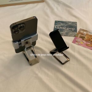 จักรวาลแห่งความทันสมัย คัมเปญการขายของขวัญที่ไม่ซ้ำใคร แผ่นรองโทรศัพท์มือถือแบบพับได้พร้อมหัวเข็มขัด ปรับระดับได้ 360 องศา ขนาดกะทัดรัด สำหรับโทรศัพท์มือถือ