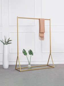 Luxury Gold Clothing Display Rack Free Standing for Womens Wear Shop Metal Construction Easy to Assemble Fashion Showroom Rack