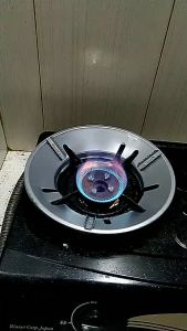 Tatakan Tungku Alas Cover Kompor Hemat Gas Anti Angin Tahan Licin Memasak Lebih Cepat