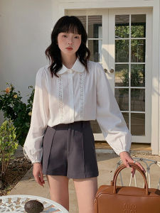 เสื้อเชิ้ตคอปกตุ๊กตาแขนยาวผ้าลูกไม้สีขาว ทรงหลวม ทรงสั้น สำหรับผู้หญิง ฤดูใบไม้ผลิและฤดูใบไม้ร่วง ดีไซน์สไตล์เกาหลี