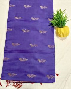 KANCHIPURAM SOFT silk saree with copper JARI Purple silk saree with intricate silver patterns and red tassels.