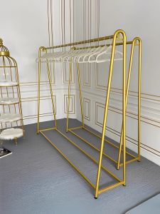 Gold Clothing Display Rack for Womens Store Free-Standing Fashion Showroom Metal Construction Customizable Luxury Design