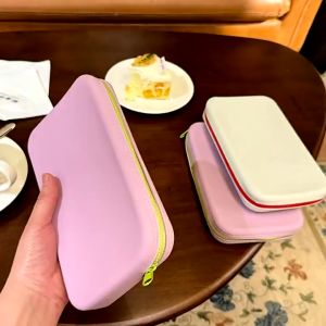 Large Silicone Makeup Bag MMM-04: A Compact & Waterproof Organizer\\n\\n Introduction to the Large Silicone Makeup Bag\\n\\nIntroducing the Large Silicone Makeup Bag MMM-04, a compact and waterproof cosmetic organizer that's perfect for travel. This versatile makeup bag is designed to keep your beauty essentials safe and organized, no matter where your journey takes you.\\n\\n Key Features of the MMM-04 Travel Bag\\n\\nThe Large Silicone Makeup Bag MMM-04 boasts several key features that make it stand out among other travel makeup pouches:\\n\\n- **Water and Oil Proof Protection:** The bag is made from high-quality silicone material that repels water and oil, ensuring your cosmetics remain dry and clean.\\n- **Soft and Drop Resistant Design:** The soft silicone material provides excellent shock absorption, protecting your makeup items from damage during travel.\\n- **Class A Food Grade Silica Gel:** The bag is made from Class A food grade silica gel, which is safe for contact with food and skin.\\n- **FAA & LFGB Test Compliance:** The Large Silicone Makeup Bag has passed both FAA (Federal Aviation Administration) and LFGB (German Food, Consumer Goods, and Feed Code) tests, ensuring its safety and quality.\\n\\n Why Choose the Large Silicone Makeup Bag?\\n\\nThe Large Silicone Makeup Bag MMM-04 offers several benefits over traditional makeup bags:\\n\\n- **Waterproof:** The bag's waterproof design keeps your cosmetics dry and protected from spills and splashes.\\n- **Soft and Drop Resistant:** The soft silicone material provides excellent shock absorption, protecting your makeup items from damage during travel.\\n- **Class A Food Grade Silica Gel:** The bag is made from Class A food grade silica gel, which is safe for contact with food and skin.\\n- **FAA & LFGB Test Compliance:** The Large Silicone Makeup Bag has passed both FAA and LFGB tests, ensuring its safety and quality.\\n\\n How to Use the Large Silicone Makeup Bag\\n\\nUsing the Large Silicone Makeup Bag MMM-04 is simple:\\n\\n- **Packing Your Cosmetics:** Start by organizing your makeup items, grouping similar products together. Then, place them inside the bag, making sure to keep heavier items at the bottom.\\n- **Cleaning and Maintenance:** To clean the bag, simply wipe it down with a damp cloth and mild soap. Allow it to air dry completely before storing.\\n\\n Benefits of Using the Large Silicone Makeup Bag\\n\\nThe Large Silicone Makeup Bag MMM-04 offers several benefits that make it an excellent choice for travelers:\\n\\n- **Water and Oil Proof Protection:** The bag's waterproof design keeps your cosmetics dry and protected from spills and splashes.\\n- **Soft and Drop Resistant Design:** The soft silicone material provides excellent shock absorption, protecting your makeup items from damage during travel.\\n- **Class A Food Grade Silica Gel:** The bag is made from Class A food grade silica gel, which is safe for contact with food and skin.\\n- **FAA & LFGB Test Compliance:** The Large Silicone Makeup Bag has passed both FAA and LFGB tests, ensuring its safety and quality.\\n\\nIn conclusion, the Large Silicone Makeup Bag MMM-04 is a compact, waterproof, and durable cosmetic organizer that's perfect for travel. With its water and oil proof protection, soft and drop resistant design, and class A food grade silica gel, this makeup bag is a must-have for anyone who values organization and safety while traveling.\"