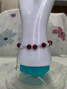 Red Beaded Bracelet with Silver Chain on Mannequin Display