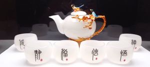 Bộ ấm trà Bạch ngọc hoạ tiết hoa đào và chim mùa xuân.