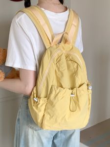 กระเป๋าหนังสือลําลองสไตล์ญี่ปุ่นสําหรับผู้หญิง 2024 ใหม่กระเป๋าเป้สะพายหลังน้ําหนักเบาเหมาะสําหรับวิทยาเขตและน้ําป้องกันการกระเด็น