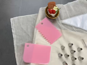 Pink Green cake decorating set with 50 pieces including piping bags tips spatulas whisks scissors cookie cutters and 40 cupcake liners.