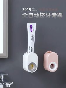 Automatic toothpaste dispenser Simple toothbrush holder Convenient brushing appliance Toiletries