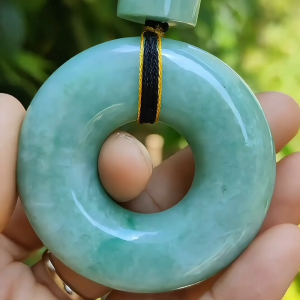 Hugh Light Green crafted with Shape of Donut and Cylinder Natural Type A Jadeite Jade as Pendant certificate weighs 73.85 and 12.55 grams measurements 52.8 * 52.7 * 14.3 19.1 * 16.3 mm (pendant290)