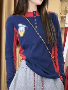 เสื้อยืดคอกลมแขนยาวผู้หญิงสไตล์อเมริกันย้อนยุคพิมพ์ลายการ์ตูนสีบล็อกเข้ารูปทรงสลิมฟิตมีกระดุมเดียวสำหรับฤดูใบไม้ผลิ