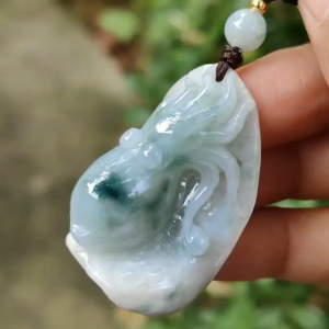 Crafted as Octopus Pendant on Natural Type A Jadeite Jade with rough skin certificate weighs 20.48 grams measurement 38.6 * 20.3 * 17 mm (pendant354)