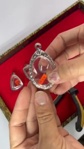 กรอบพระ/ตลับพระสแตนเลสลายไทย รูปทรงลูกอม