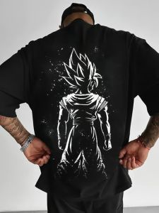 Bandai | Dragon Ball Super Saiyan Son Goku Back Print Black T-Shirt White Spiky Hair Upward Pose Halo Effect Star Particles Dynamic Anime