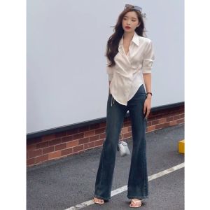 เสื้อเชิ้ตแขนยาวสไตล์ฝรั่งเศสสำหรับผู้หญิง ฤดูใบไม้ผลิและฤดูใบไม้ร่วง เสื้อเชิ้ตทรงเข้ารูปไม่สมมาตรดีไซน์ไม่ซ้ำใคร ทรงหลวมๆ สไตล์ลำลอง เสื้อเชิ้ตกระชับสัดส่วน