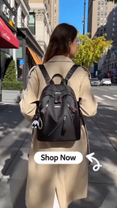 CJY SHOP#8868 Fashion nylon 12inches backpack for women featuring diagonal front zipper and an cartoon bear keychain.