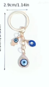 พวงกุญแจแฟชั่น การออกแบบตาชั่วร้ายและเสน่ห์มือฮอชามา วัสดุโลหะผสม เครื่องประดับแฟชั่นสตรีธีมการ์ตูน พร้อมรายละเอียดRhinestone หัวเข็มขัดแหวนตกแต่ง เหมาะสำหรับวันเกิดและ เทศกาล