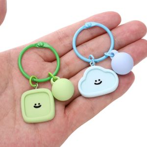 ลูกปัดพวงกุญแจพวงกุญแจรูปมาการองหน้ายิ้มสีลูกอมเรซิ่น1ชุด/ถุงสำหรับ DIY อุปกรณ์เสริมจิวเวลรี่