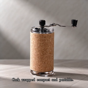 VOLKAFE manual coffee mill with cork handle and transparent container.
