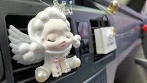 kẹp cửa gió điều hòa Ô tô hình gấu và bông hoa trà sang trọng được tặng kèm 1 lọ nước hoa 10ml
