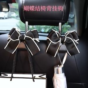 Móc treo đồ xe hơi hình nơ - Móc treo đồ sau ghế xe ô tô