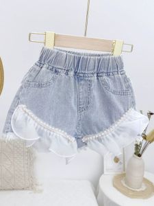 กางเกงขาสั้นเด็กผู้หญิงสไตล์เกาหลี ทรงเข้ารูป ผ่าหน้า ขอบลูกไม้ เอวกลาง ทรงหลวม กางเกงยีนส์ทรงเข้ารูป ฤดูร้อน 2025