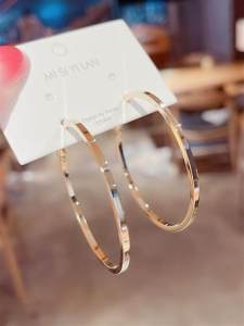 Trendy Summer Collection: Women's Large Circle Hoop Earrings\\n\\n Introduction to Exaggerated Hoop Earrings\\n\\nExaggerated hoop earrings have become a popular trend among women who want to make a bold statement with their jewelry. These large circle hoop earrings are perfect for those who appreciate elegant and fashionable designs that can elevate any outfit.\\n\\n What Are Exaggerated Hoop Earrings?\\n\\nExaggerated hoop earrings are oversized, circular earrings that hang from the earlobes. They come in various sizes, shapes, and materials, including alloy plated silver gold. These earrings are designed to catch the eye and add a touch of glamour to any look.\\n\\n Key Features of Large Circle Hoop Earrings\\n\\n* Oversized design\\n* Circular shape\\n* Alloy plated silver gold material\\n* Elegant and fashionable design\\n\\n The Appeal of Alloy Plated Silver Gold Earrings\\n\\nAlloy plated silver gold earrings are a popular choice for women who want to add a touch of luxury to their jewelry collection. These earrings are made using a process called electroplating, which involves coating a base metal with a thin layer of precious metal, such as gold or silver. This process creates a durable and affordable alternative to solid gold or silver earrings.\\n\\n How to Choose the Right Alloy Plated Silver Gold Earrings\\n\\nWhen choosing alloy plated silver gold earrings, consider the following factors:\\n\\n* Size: Choose a size that complements your face shape and personal style.\\n* Shape: Consider the shape of the earring, such as round, oval, or teardrop.\\n* Material: Look for earrings made with high-quality alloy plated silver gold.\\n* Style: Choose earrings that match your personal style and complement your outfit.\\n\\n Caring for Your Alloy Plated Silver Gold Earrings\\n\\nTo keep your alloy plated silver gold earrings looking their best, follow these care tips:\\n\\n* Store them in a cool, dry place.\\n* Avoid exposing them to water, perfume, or other chemicals.\\n* Clean them regularly with a soft cloth.\\n* Avoid wearing them while sleeping or exercising.\\n\\n Styling Tips for Large Circle Hoop Earrings\\n\\nLarge circle hoop earrings can be styled in many different ways to suit your personal taste and outfit. Here are some styling tips to help you get started:\\n\\n Pairing Exaggerated Hoop Earrings with Different Outfits\\n\\n* Casual: Pair them with a simple t-shirt and jeans for a relaxed look.\\n* Office: Wear them with a blouse and skirt for a professional yet stylish appearance.\\n* Evening: Combine them with a dress and heels for a glamorous evening look.\\n\\n Complementary Accessories for Large Circle Hoop Earrings\\n\\n* Necklaces: Choose a delicate necklace to balance out the boldness of the earrings.\\n* Bracelets: Add a few bangles or a stack of bracelets to complete the look.\\n* Rings: Select a statement ring or a set of smaller rings to complement the earrings.\\n\\n The Future of Women's Exaggerated Earrings\\n\\nThe trend for exaggerated earrings is only getting bigger, with new styles and designs emerging every season. Here are some emerging trends to watch out for:\\n\\n Emerging Trends in Exaggerated Earrings\\n\\n* Geometric shapes\\n* Layered designs\\n* Mixed metals\\n* Embellished details\\n\\n How to Stay Ahead of the Curve in Exaggerated Earring Fashion\\n\\nTo stay ahead of the curve in exaggerated earring fashion, keep up with the latest trends by following fashion bloggers and influencers on social media. Experiment with different styles and designs to find what works best for you. And most importantly, have fun and express yourself through your jewelry choices!\\n\\n Conclusion\\n\\nIn conclusion, large circle hoop earrings are a trendy and fashionable accessory that can elevate any outfit. Whether you prefer a casual or formal look, there is a pair of alloy plated silver gold earrings that will suit your style. By following the tips outlined in this article, you can choose the right earrings for you and care for them properly to ensure they last a long time. So why not treat yourself to a pair of these stunning earrings today?\"