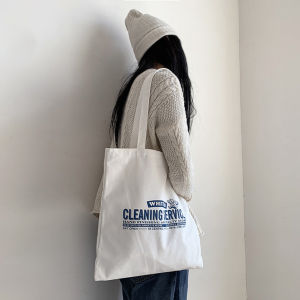 กระเป๋าผ้าใบสะพายไหล่แบบหนังสืออักษรเกาหลี กระเป๋าผ้าใบแฟชั่นสำหรับนักเรียน กระเป๋าสะพายไหล่แบบอเนกประสงค์สำหรับทั้งชายและหญิง กระเป๋าผ้าใบแบบลำลอง