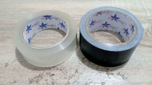 Isolasi Bening 15 inch-12M /Hitam 2 inch-100 YARDLakban buku/jilid HITAM dan lakban packing BENING