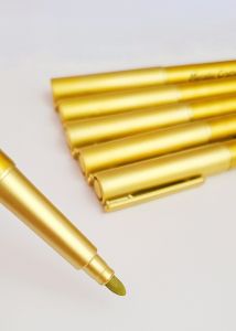 Gold and silver metallic markers with fine tips for writing and drawing.
