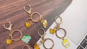 Bandai | Bộ Móc Khóa Hình Quái Vật Hoạt Hình Anime Dễ Thương 1/6 Chất Liệu Kim Loại Tráng Men Kèm Charm Hình Bướm Dùng Trang Trí Túi Xách Ví Phụ Kiện Ô Tô