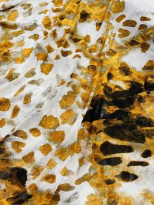 Voan thun lưới họa tiết trắng đen xinh xắn . Chất thun co giãn tốt. Khổ vải 15m