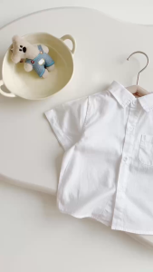 Áo sơ mi trắng ngắn tay phối túi cho bé trai phong cách Hàn quốc size 9 tới 28kg Bernie H0125A12