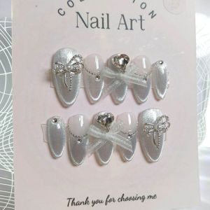 Móng tay thiết kế Nail box mắt mèo bạc nơ ruy băng vải mã số AB36