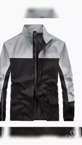 Blue and black color block jacket with zip front and elastic cuffs.