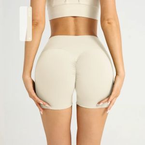 กางเกงขาสั้นสำหรับเล่นโยคะแบบไร้รอยต่อของผู้หญิงกางเกงขาสั้นแห้งเร็วยกสะโพกกางเกงขาสั้นสำหรับเล่นฟิตเนสสีพื้นสำหรับฤดูร้อนกางเกงวิ่งเล่นโยคะลำลอง