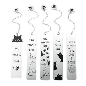 A theme bookmark with paw charm - "You Pawsed Here" quote and cute cat design suitable for cat enthusiasts book lovers.