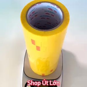 Băng keo màu vàng OPP rộng 2.4cm dài 75 mét lõi giấy 3mm 1 cây 12 cuộn giá tại xưởng