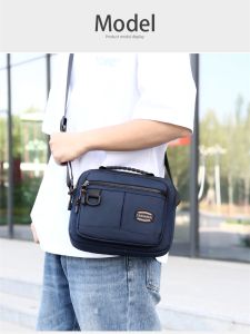 กระเป๋าผ้าอ็อกซ์ฟอร์ดใหม่สำหรับผู้ชาย กระเป๋าสะพายไหล่ข้างเดียวแบบย้ายได้ กระเป๋าใส่ของใช้ในงาน สไตล์ลำลอง กระเป๋าสะพายข้างแบบย้ายได้